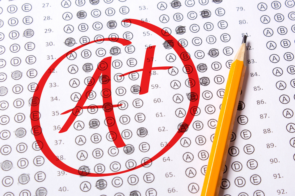 Good grade of A plus (A+) is written with  red pen on the tests.